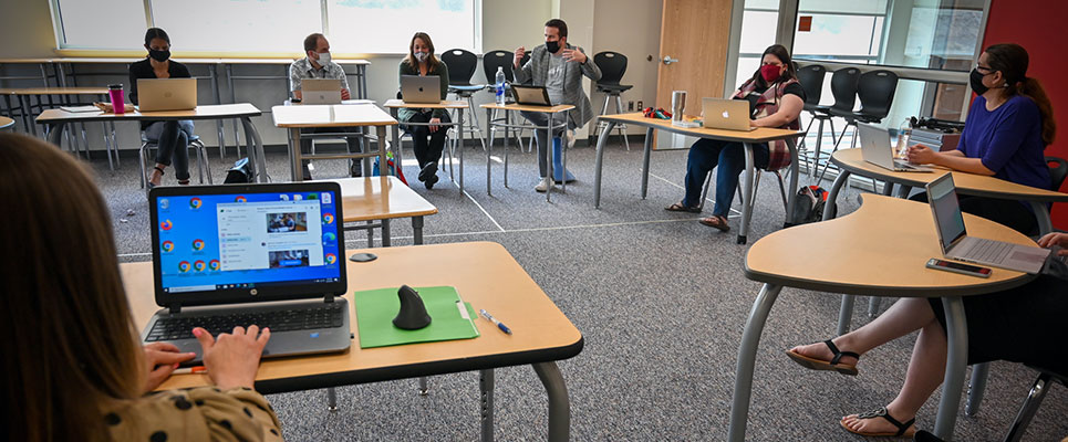 Staff meets to work together
