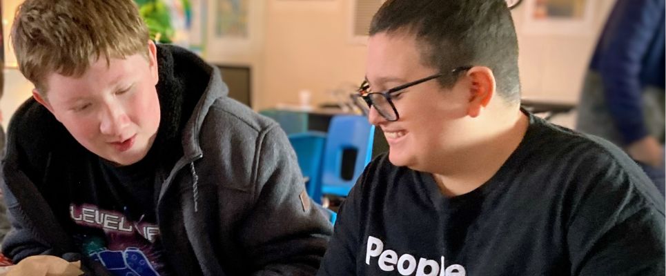 Two Students Laughing and Working together